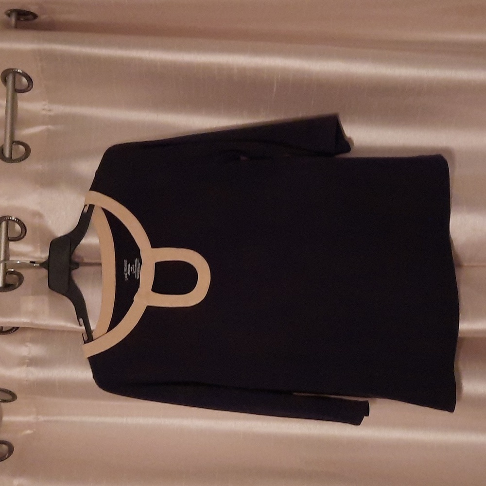 Lane Bryant size 14/16 black shirt with tan detail around neck and opening.